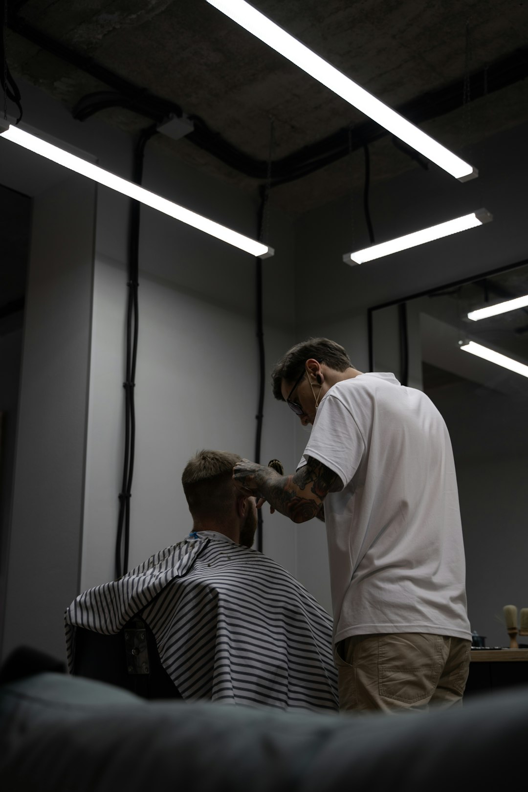 Professional stylist working with client